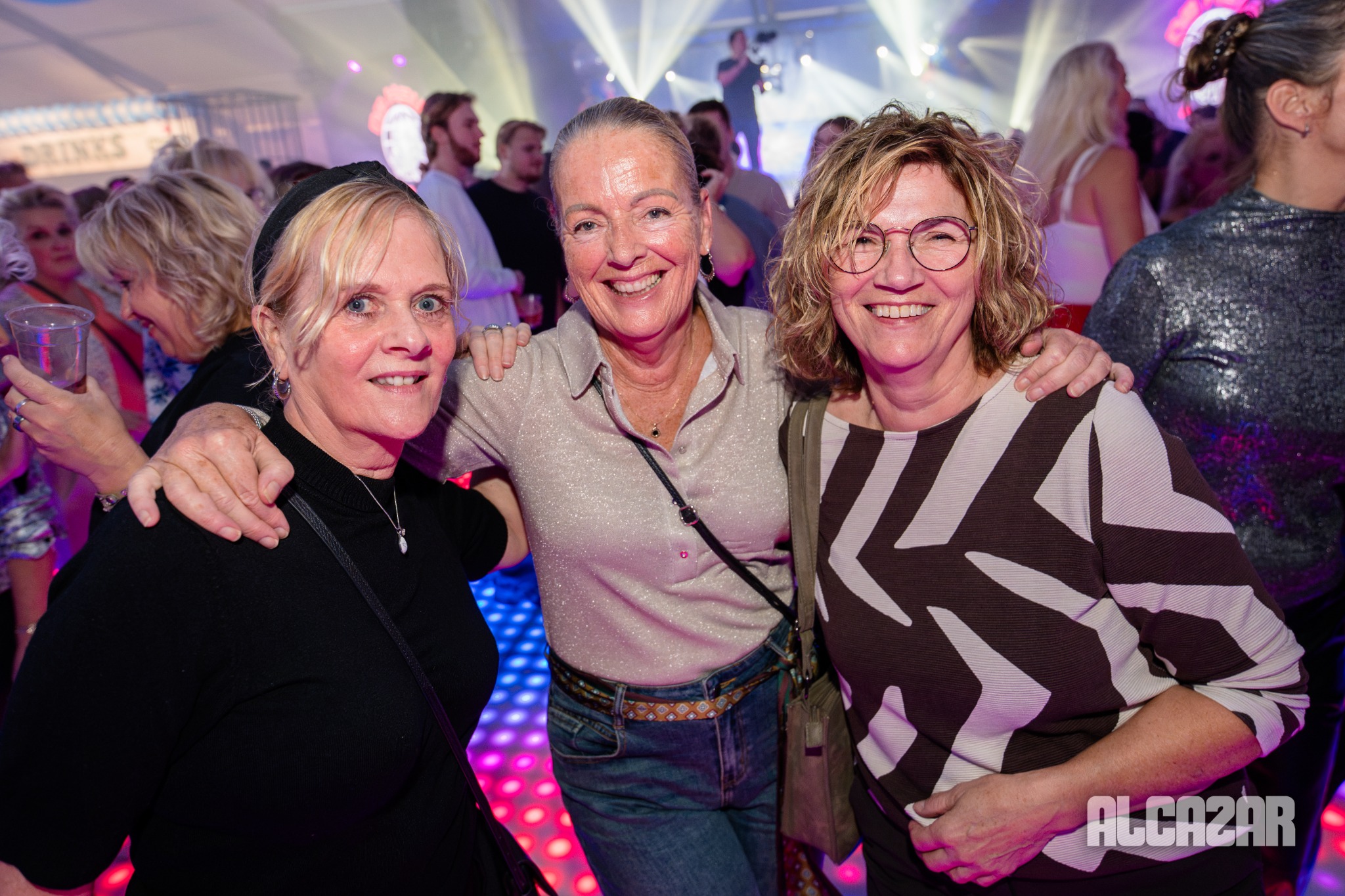 Drie bezoekers samen op de foto